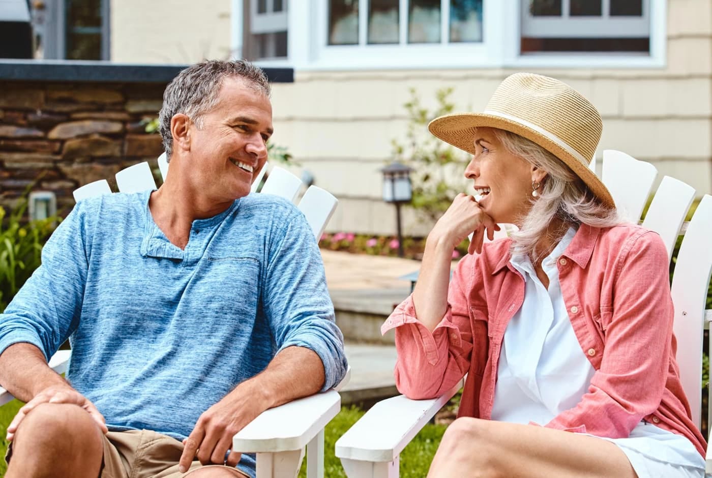 Smiling couple chtting outdoors