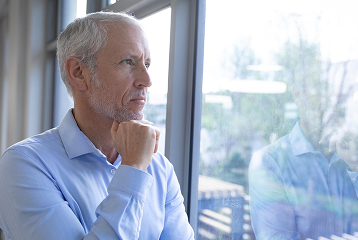 Mature man looking at his phone