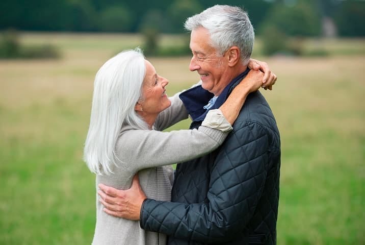 Senior couple smiling together — start your dating journey with Sequel