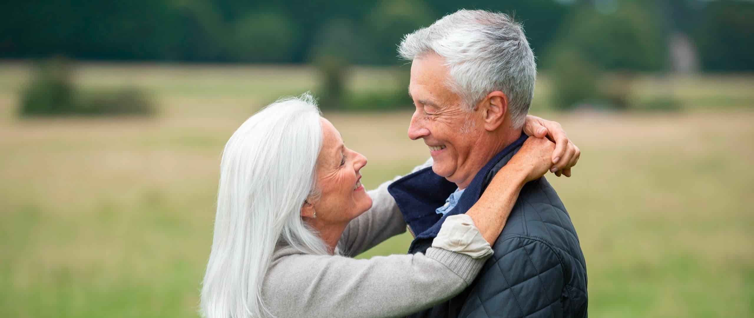 Senior couple smiling together — start your dating journey with Sequel